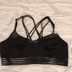 Pink sports bra. Size medium. Black and see thru